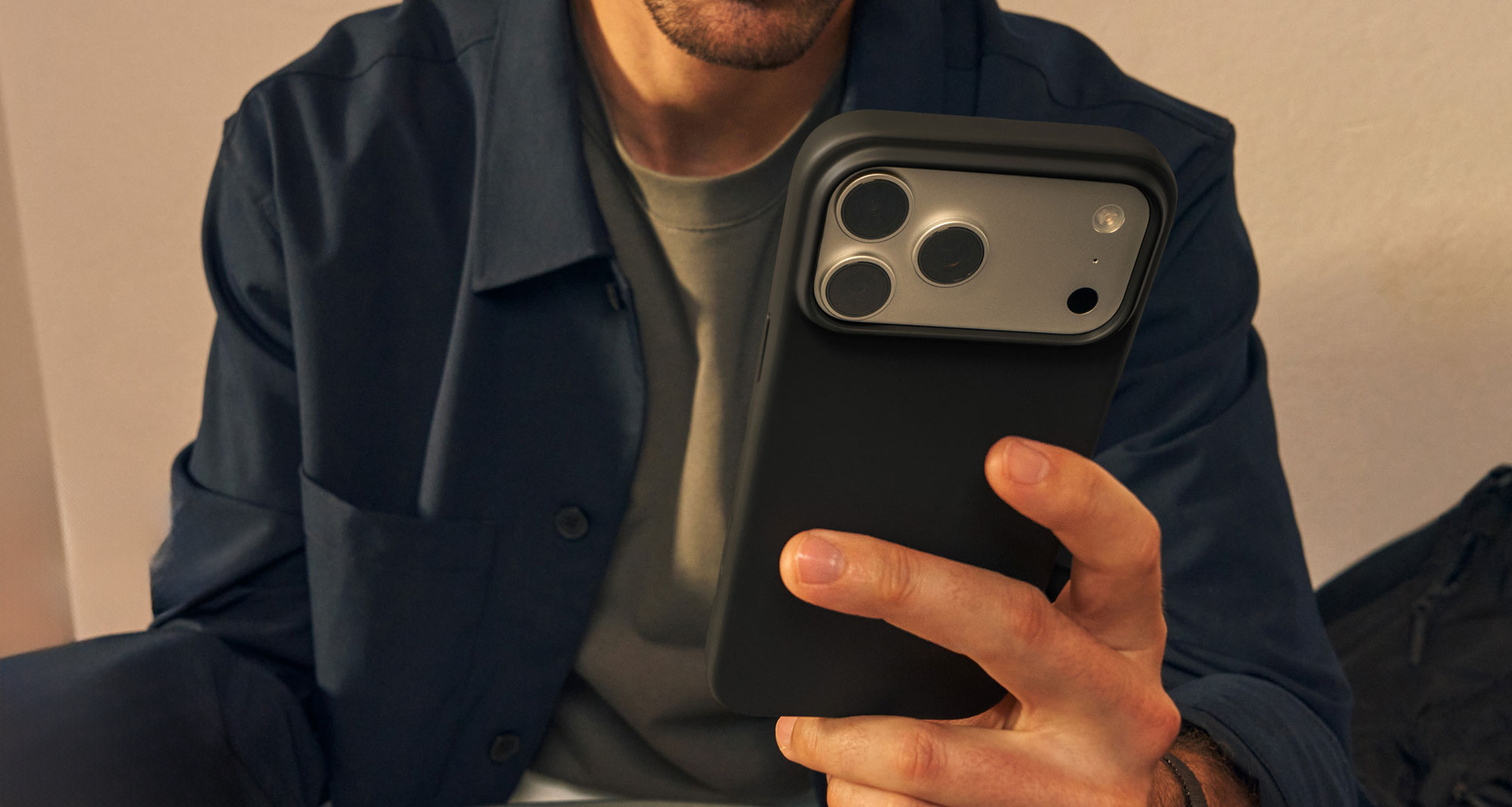 Person holding iPhone with Orso app — local-first privacy by default